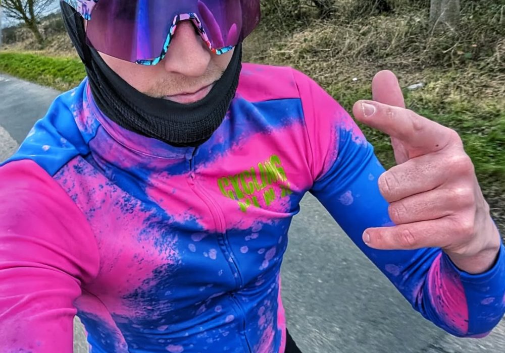 Cycling Punx bike rider wearing pink and blue jersey