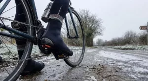 cyclist wearing overshoes in winter