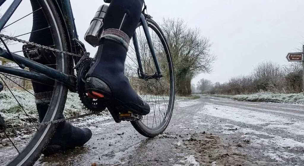 cyclists wearing overshoes whilst cycling int he winter
