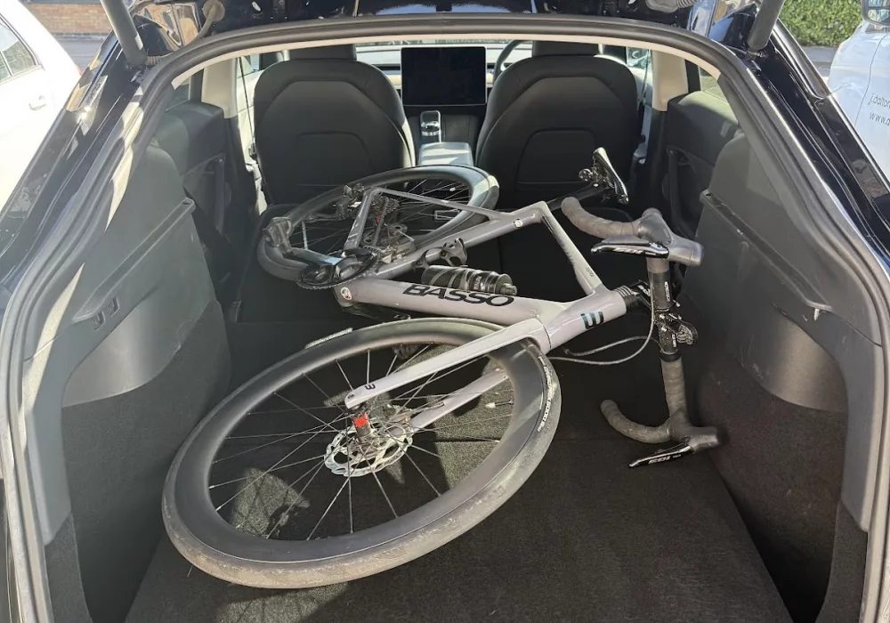 Road bike in boot of Tesla model Y