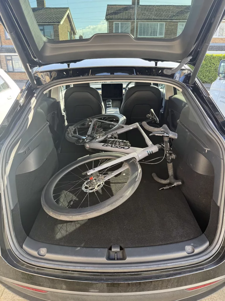 Road bike in boot of Tesla model Y
