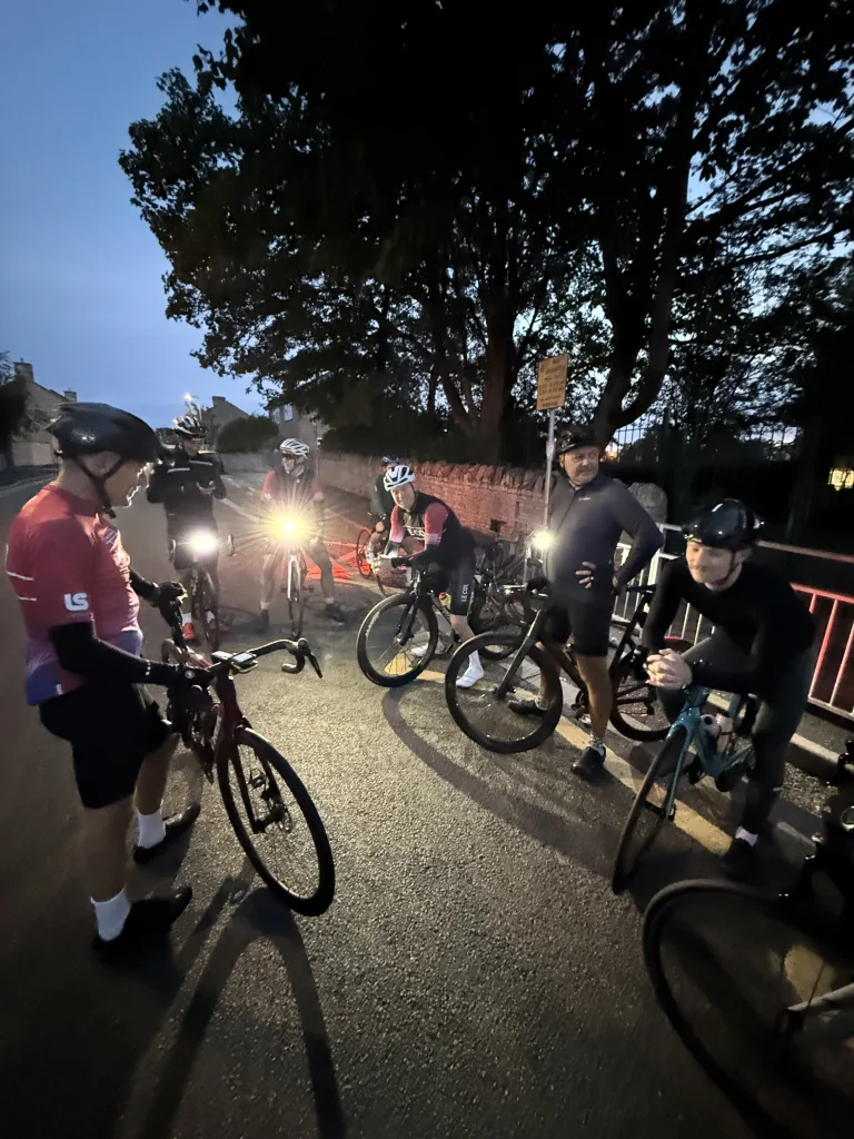 Stamford Cycling club outside St Gilberts school in the dark